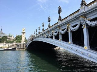 bridge over a river in Paris while on a river cruise-couples bucket list